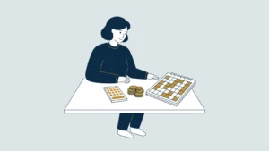On-call worker at a table with a calculator, coins and a calendar with irregularly filled days